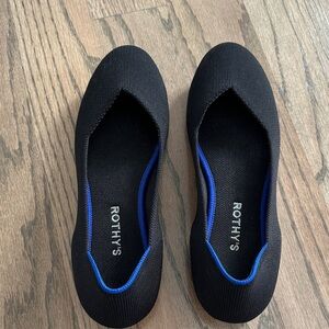Rothy's Elegant Black Flats with Blue Trim